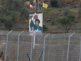 A photo of Nasrallah on the fence of the Lebanese border