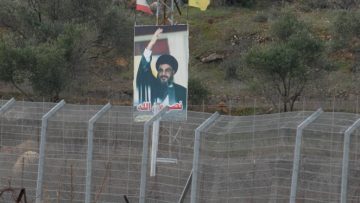 A photo of Nasrallah on the fence of the Lebanese border